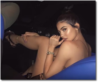 Kylie Jenner looking super sexy nibbling her thumb while sitting in a car seat June 16, 2017
